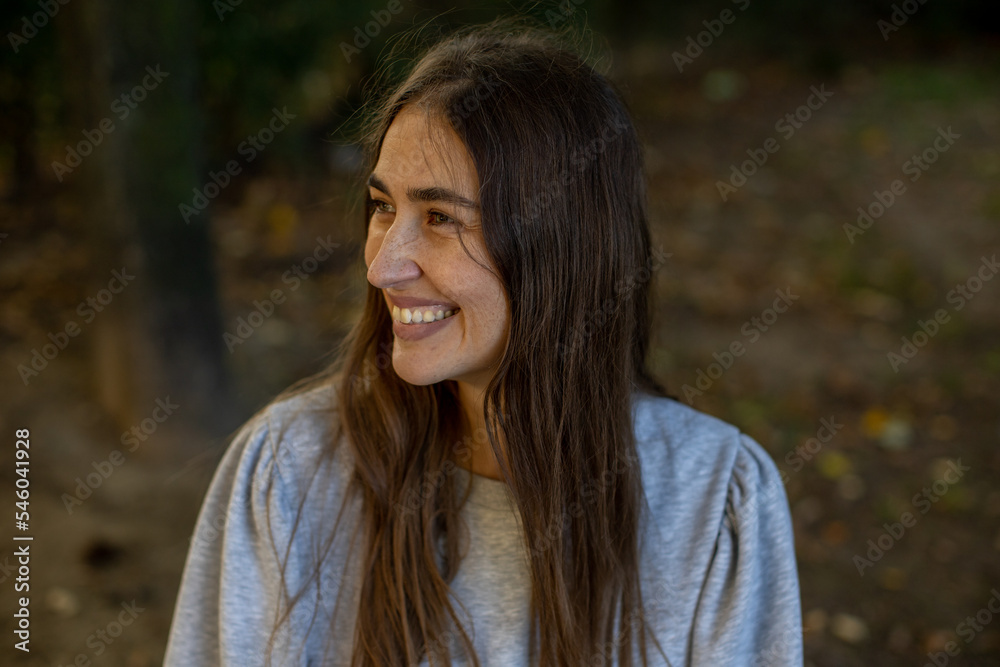 relaxed woman smiling and enjoying outdoors relaxed woman smiling and enjoying outdoors
