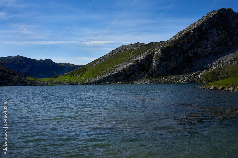 Beautiful scene of Lakes of Covadonga, Asturias, Spain with green hills and blue sky