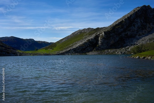 Beautiful scene of Lakes of Covadonga, Asturias, Spain with green hills and blue sky