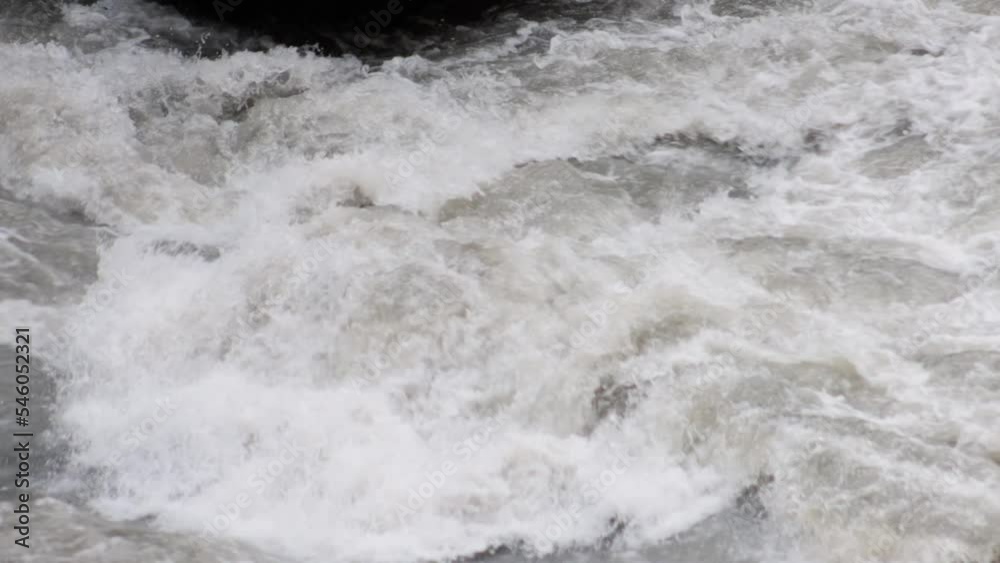 An old abandoned highway in the mountains. Muddy mountain river in a deep gorge. slow motion. An old abandoned highway in the mountains. Muddy mountain river in a deep gorge. slow motion.