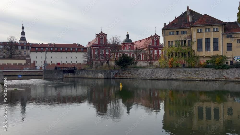 River in the city. Panorama of the town. The historic architecture of the old town. Historic buildings on the banks of the river. The center of the old town. Wroclaw, Poland. River in the city. Panorama of the town. The historic architecture of the old town. Historic buildings on the banks of the river. The center of the old town. Wroclaw, Poland.