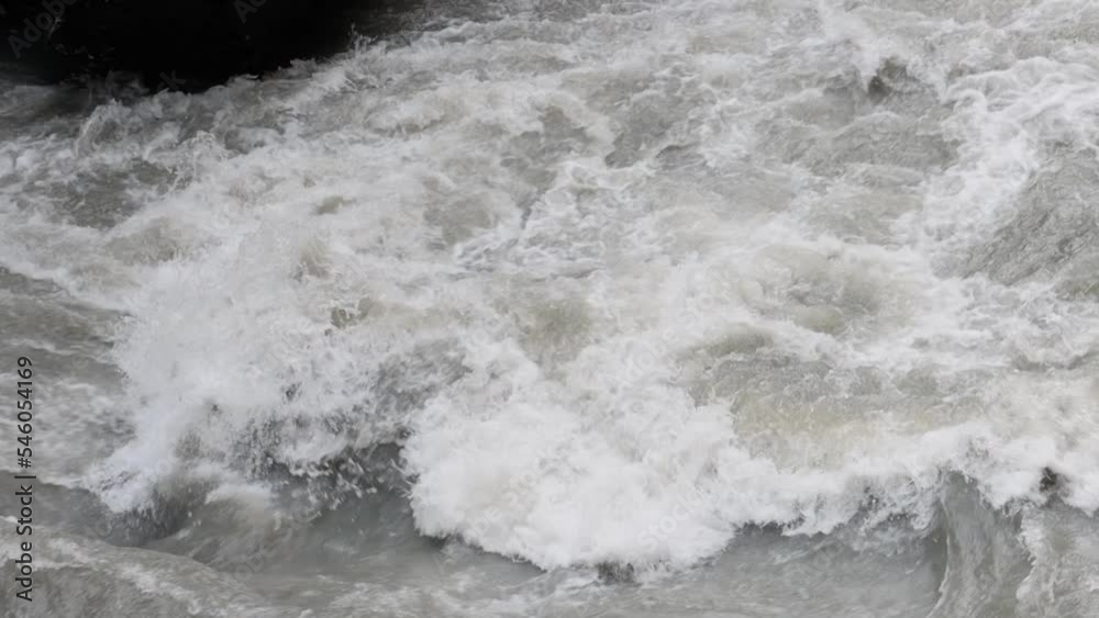 An old abandoned highway in the mountains. Muddy mountain river in a deep gorge. slow motion. An old abandoned highway in the mountains. Muddy mountain river in a deep gorge. slow motion.