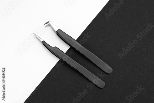 Tools for eyelashes, tweezers and brush. Black and white.