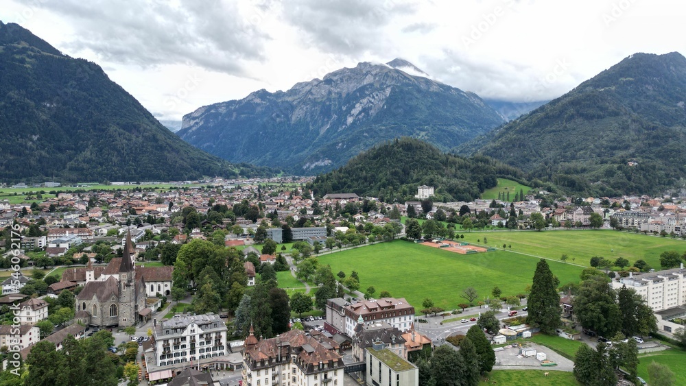 View of a small town surrounded by mountains. Interlaken, Switzerland. View of a small town surrounded by mountains. Interlaken, Switzerland.