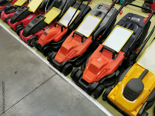 Lawn mowers are sold in the shop. Garden equipment in stock in the store. © Angelov
