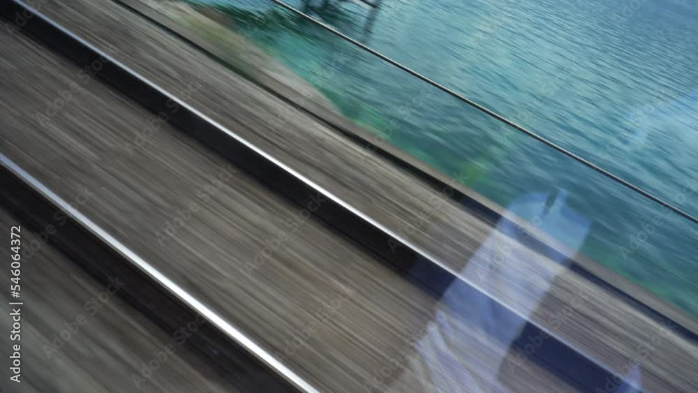 Train railroad tracks in motion high speed velocity seen through window. Passenger POV Train railroad tracks in motion high speed velocity seen through window. Passenger POV