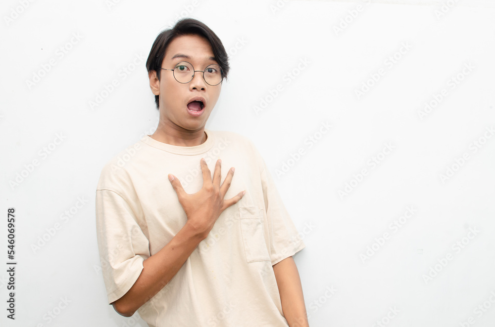 ecstatic attractive young asian man shocked happily opening mouth and lowering glasses. asian man with glasses feels shock with wow surprised expression. ecstatic attractive young asian man shocked happily opening mouth and lowering glasses. asian man with glasses feels shock with wow surprised expression.