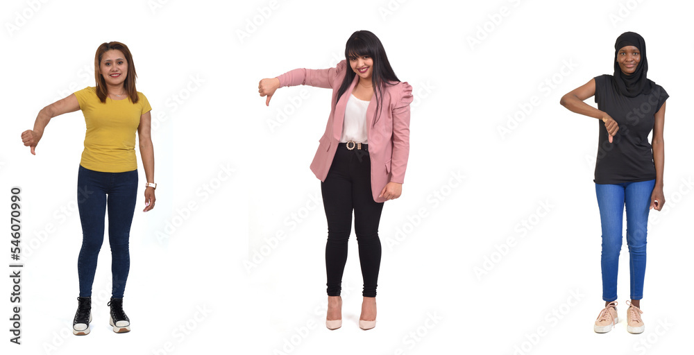 Fototapeta premium group of women thumb down over white background