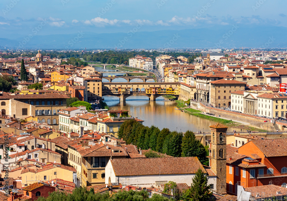 Florence cityscape with Ponte Vecchio bridge over Arno river, Italy