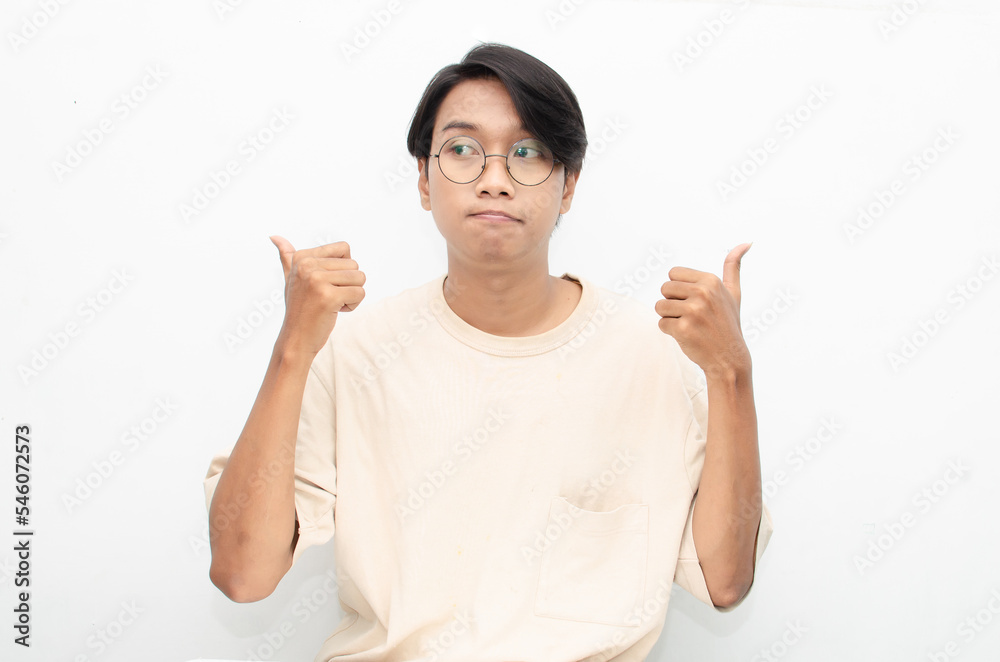 Thoughtful confused asian man thinking and wondering to choose something isolated over white background. man feeling uncertain and unsure. Thoughtful confused asian man thinking and wondering to choose something isolated over white background. man feeling uncertain and unsure.