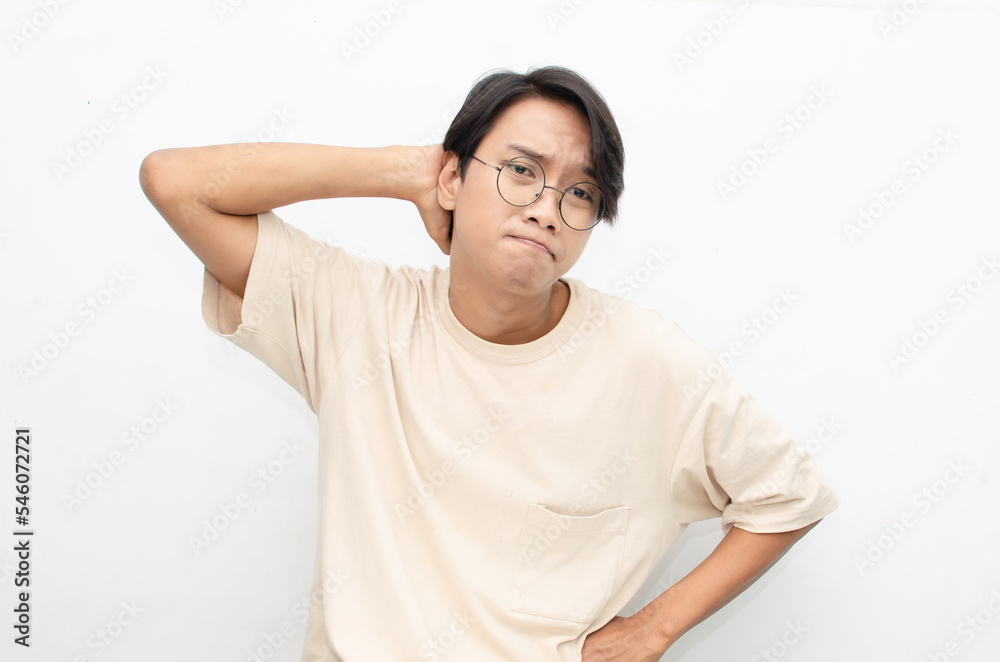 Thoughtful confused asian man thinking and wondering to choose something isolated over white background. man feeling uncertain and unsure. Thoughtful confused asian man thinking and wondering to choose something isolated over white background. man feeling uncertain and unsure.
