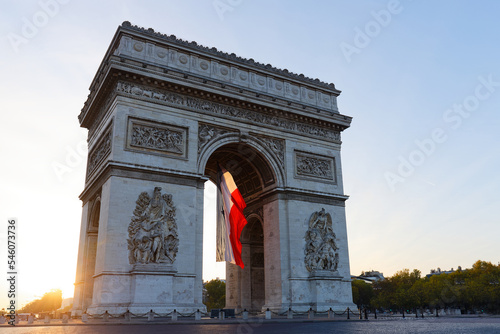 The Triumphal Arch decorated with French flag, Paris, France © kovalenkovpetr