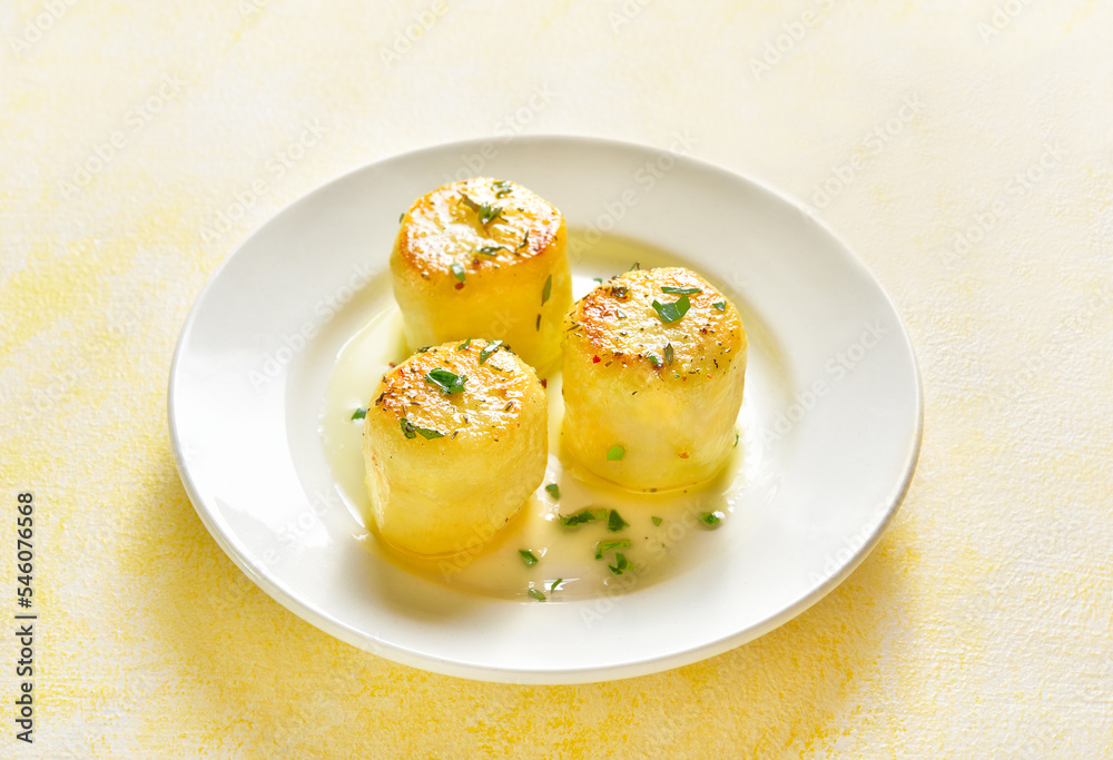 Fondant potatoes on plate Fondant potatoes on plate