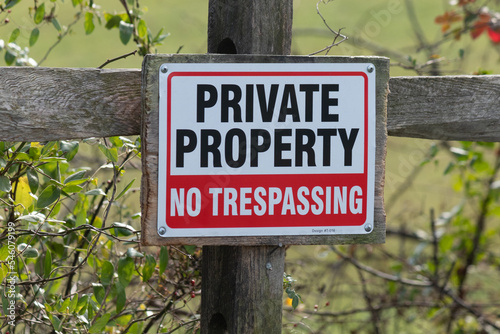 This is a typical sign you see as a hiker or a hunter. It is a private property sign indicating where you can be and where not to be. The bold red, white, and black colors really helps to standout.