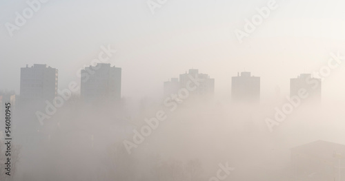 Fog in the city. High buildings in a fog. Skyline. Architecture of town in the morning. Banner and panoramic. © photosbysabkapl