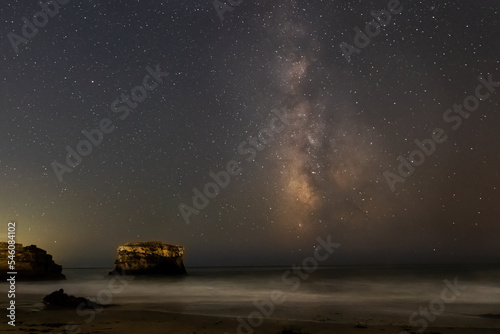 The Milky Way is raising over Natural Bridges State Beach in Santa Cruz California