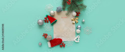 Composition with blank letter to Santa and beautiful Christmas decorations on turquoise background