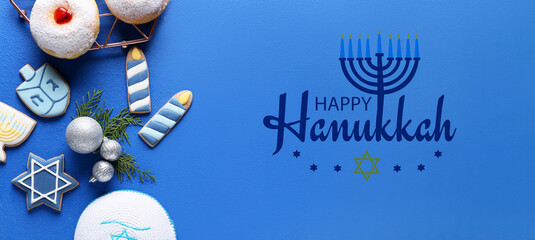 Greeting card with symbols of Hanukkah and Christmas decor on blue background