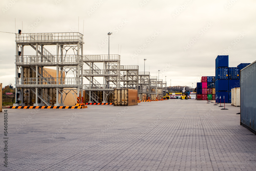 Stacked freight shipping containers and refrigerators. Refrigerated containers. Stacked containers in a shipping terminal