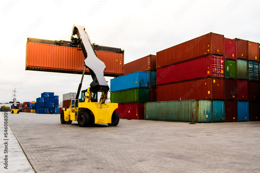 Container handlers. Forklift truck in shipping yard. Industrial container logistic yard. Logistics import export concept.