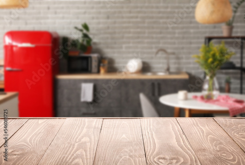 Empty wooden table in inter...