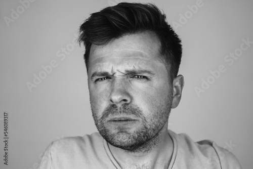 Monochrome portrait of mature sad Caucasian man 
