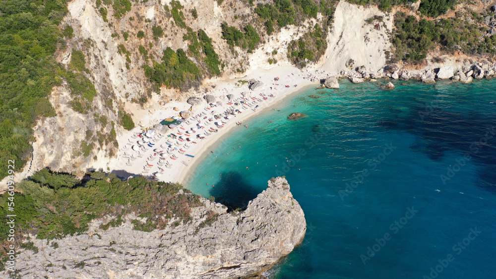 Aerial drone top down photo of tropical exotic paradise secluded rocky bay with deep turquoise sea forming a blue lagoon