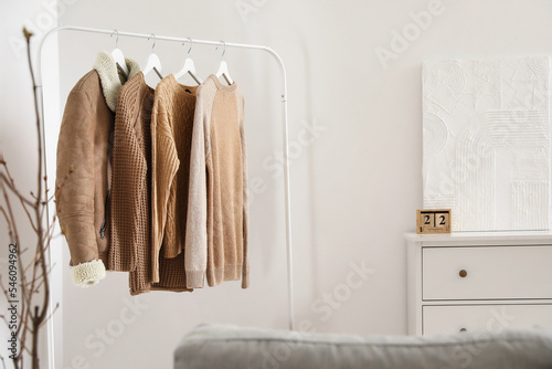 Rack with stylish warm clot...