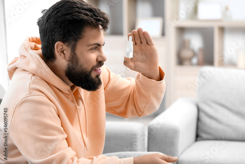Handsome man with eye drops...