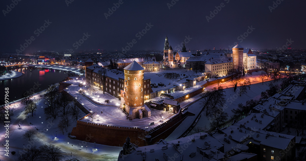 Panorama of Wawel Royal Castle at night during snowy winter, Krakow, Poland