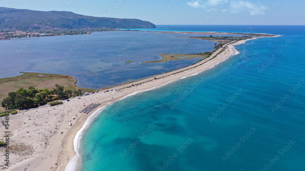 Aerial drone photo of famous sandy bay in entrance of Lefkada island called Amoglosa next to famous castle of Santa Mavra, Ionian, Greece Aerial drone photo of famous sandy bay in entrance of Lefkada island called Amoglosa next to famous castle of Santa Mavra, Ionian, Greece