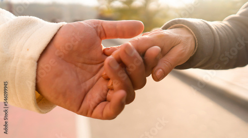 Hands closeup, man and woman support each other.