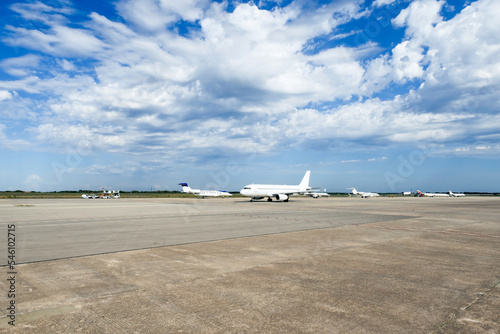 Wide angle view of planes on the tarmac at the airport