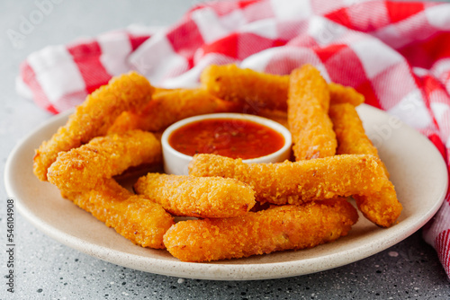 crispy fresh chicken strips on a gray stone background