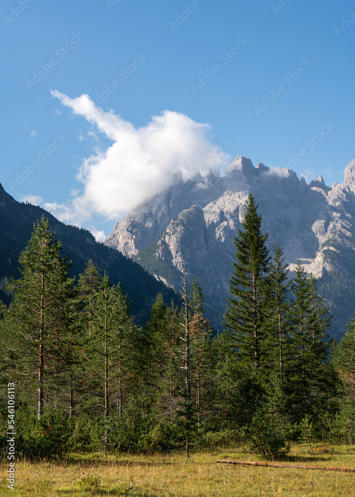Morning in the Alps. Morning fog. Blue sky. Clouds. Oes in the mountains. Stone tops. Travel. Tourism. Beautiful places on the planet. Tour in the mountains. Fresh air. Italy. Tyrol
