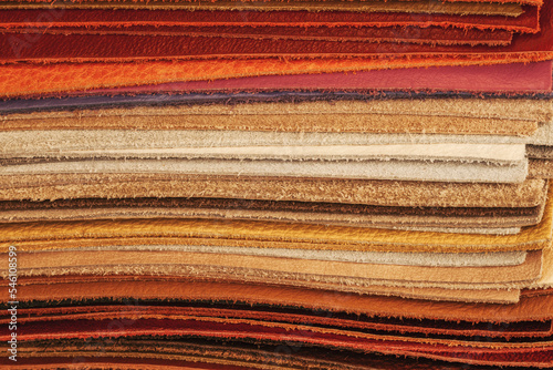 Pile of colorful multicolored leather samples. Palette collection closeup, background