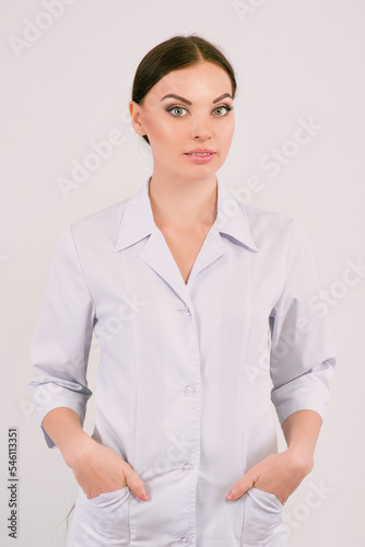 Caucasian woman doctor in white uniform