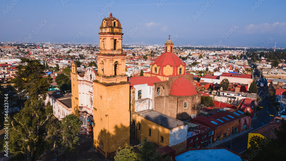 Aerial photo of Main church of Metepec, Mexico, painted yellow in the baroque style