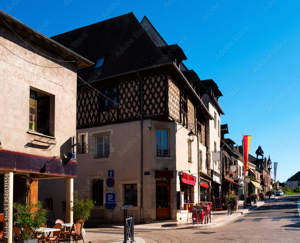 Scenic view of historic central street in small French township of Aubigny-sur-Nere with medieval half-timbered houses on summer day, Cher department
