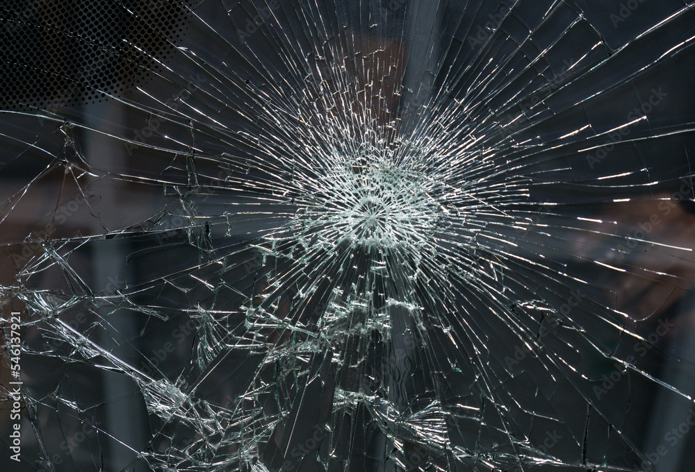 Obraz premium Image of a broken car windshield from a strong impact