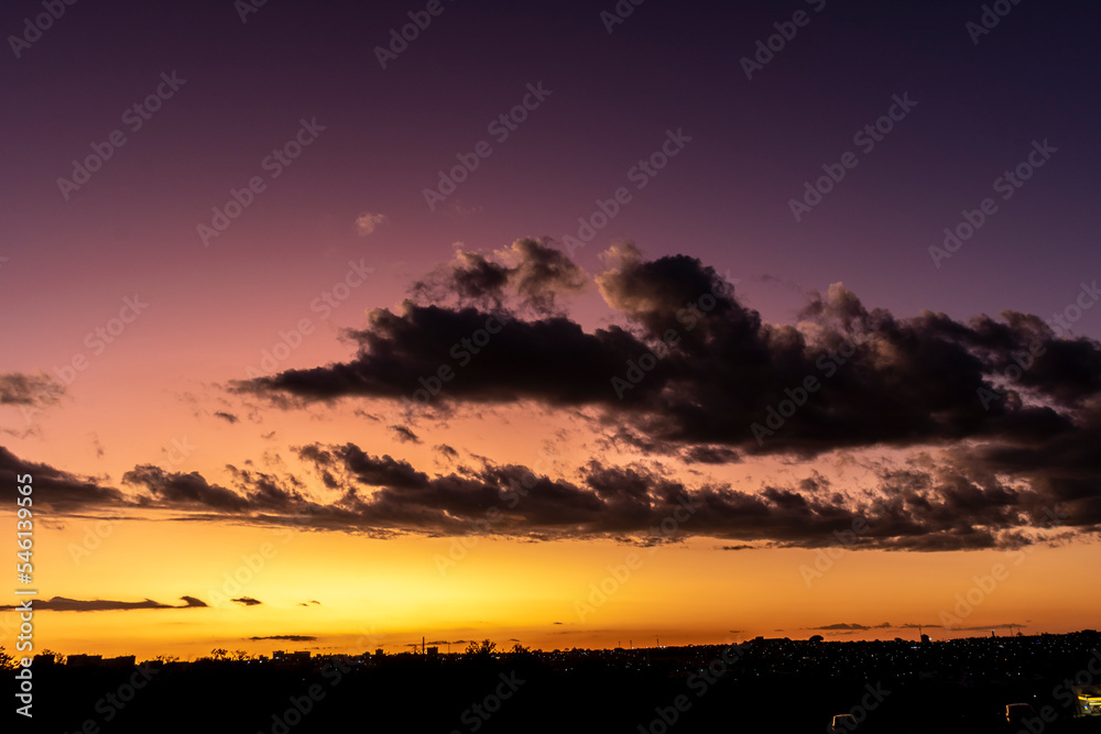 Sunset in the sky with clouds,  Awesome epic landscape. Amazing vibrant colors im Brazil