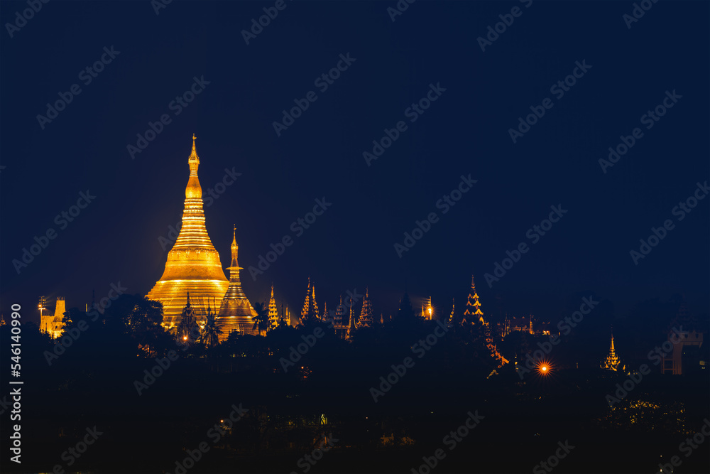 Shwedagon pagoda on hill at night in Yangon Myanmar