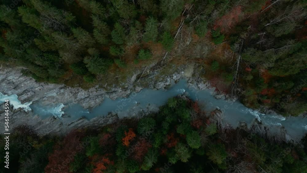 Scenic mountain river waterfall canyon with fresh blue water in the idyllic Bavaria Austria alps, flowing down a beautiful forest along trees near Sylvenstein Speicher and Walchensee. Aerial drone 4K Scenic mountain river waterfall canyon with fresh blue water in the idyllic Bavaria Austria alps, flowing down a beautiful forest along trees near Sylvenstein Speicher and Walchensee. Aerial drone 4K