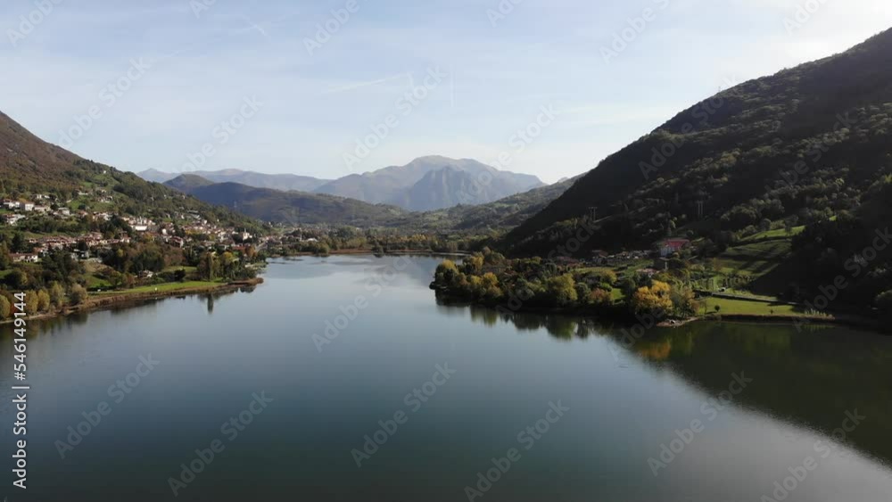 Drone slowly rotate over Endine lake in a sunny autumn day Drone slowly rotate over Endine lake in a sunny autumn day