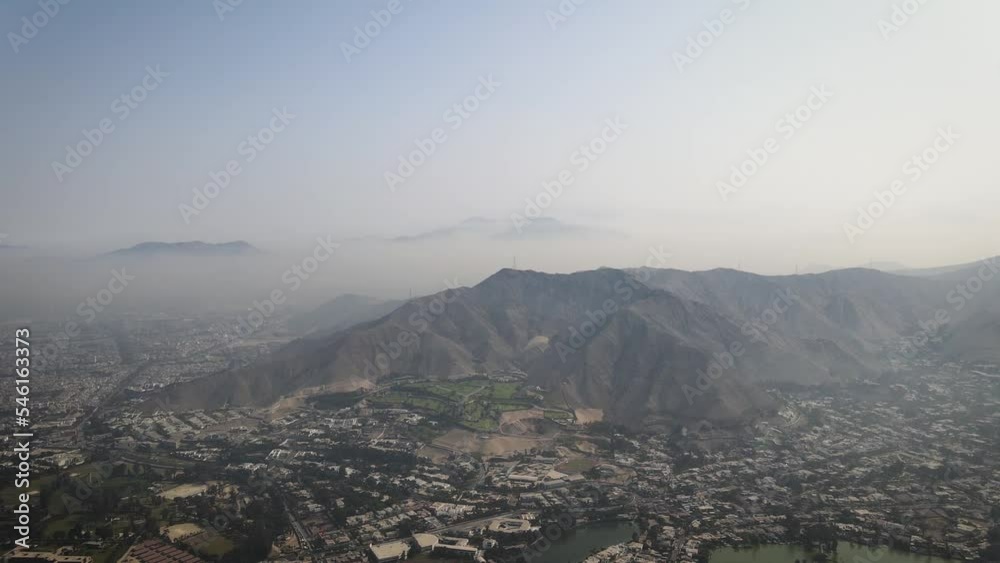 A drone shot of the mountains and misty hills in Lima Peru A drone shot of the mountains and misty hills in Lima Peru