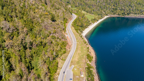 Aerial view of a road bordering a lake in southern Chile