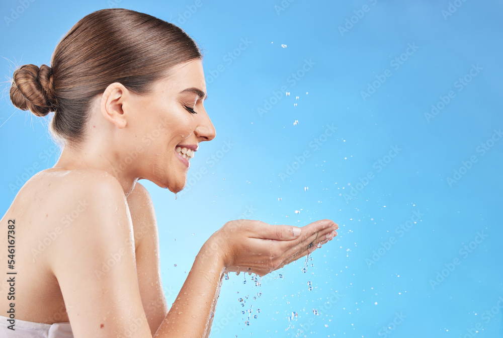 Profile, skincare and water splash of woman in studio isolated on a blue background mockup. Hygiene, cleaning and female model washing face for health, wellness and beauty or body care with mock up Profile, skincare and water splash of woman in studio isolated on a blue background mockup. Hygiene, cleaning and female model washing face for health, wellness and beauty or body care with mock up