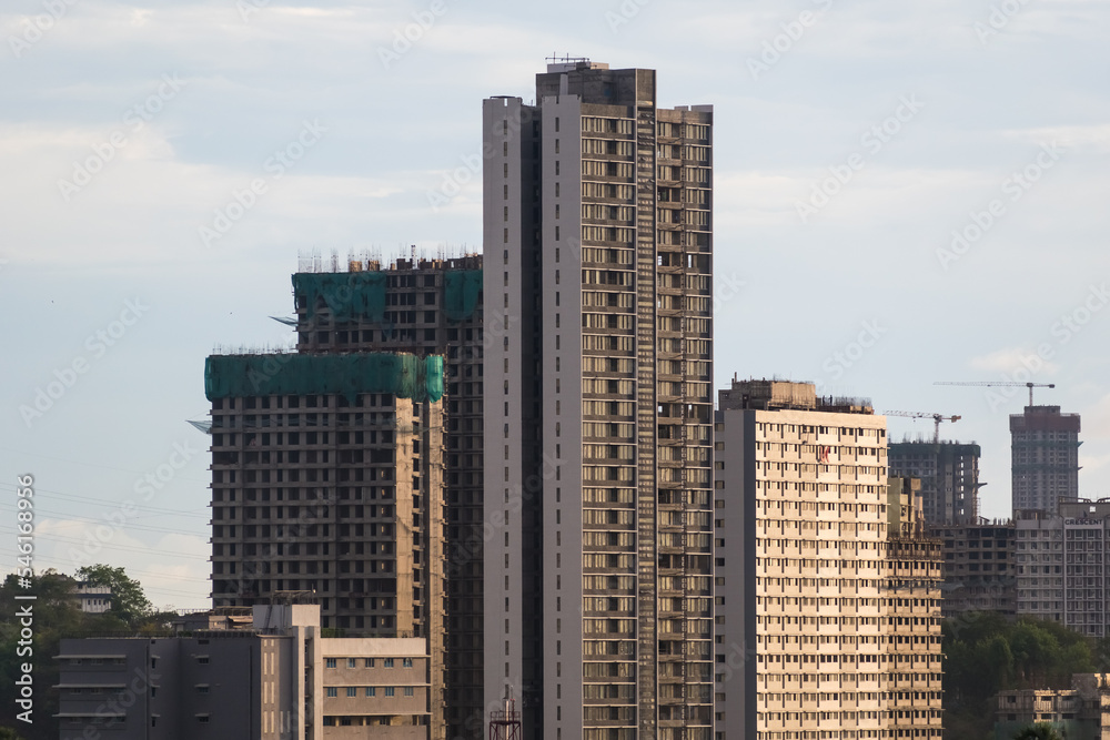 A skyline of modern concrete high rise skyscrapers in the suburb of Kandivali East in the city of Mumbai. A skyline of modern concrete high rise skyscrapers in the suburb of Kandivali East in the city of Mumbai.