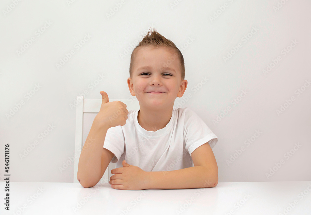 portrait of happy little boy gives thumbs up like beautiful advertisement highlighted on white background. Discount symbol of selected season portrait of happy little boy gives thumbs up like beautiful advertisement highlighted on white background. Discount symbol of selected season