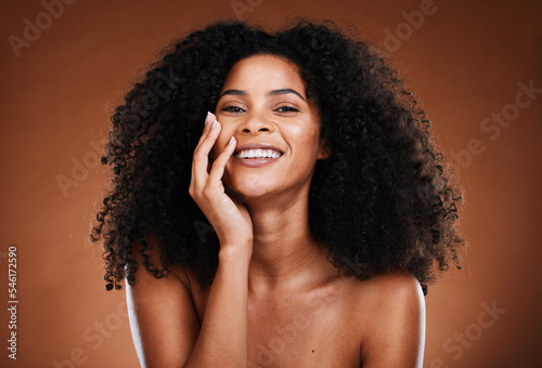 Black woman, hair and portrait with natural beauty smile for healthy cosmetic satisfaction. Beautiful, confident and happy face of skincare girl with afro hair care texture in brown studio.
